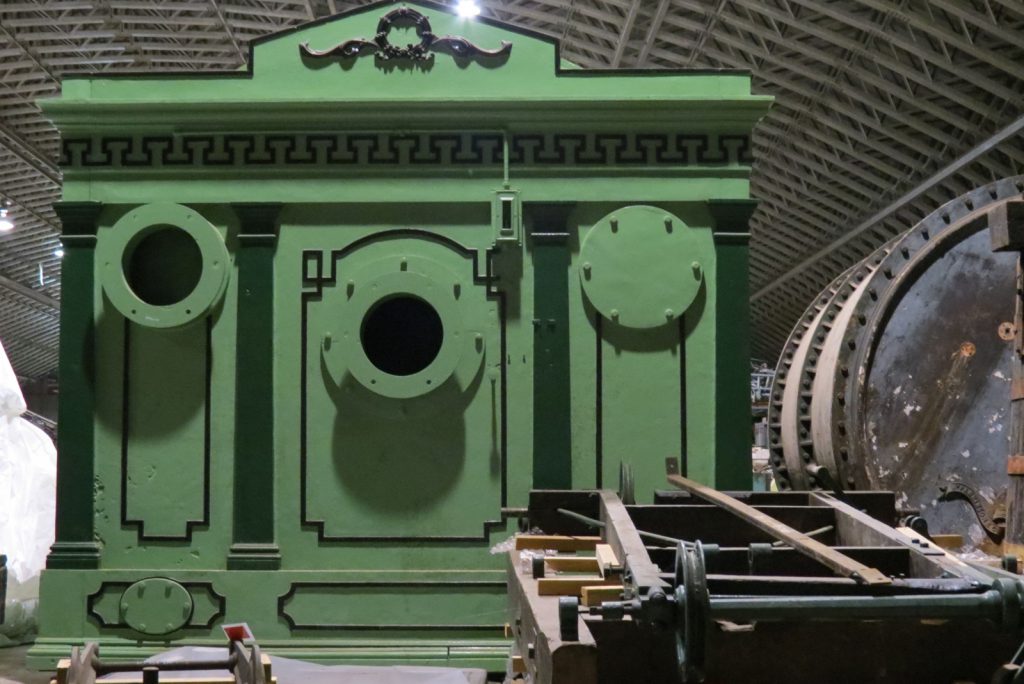 Colour photograph of a gas station meter constructed in the style of a small town hall building