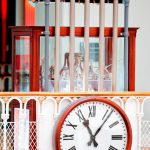 Colour photograph of a working model of a tower clock fitted with five tubular bells