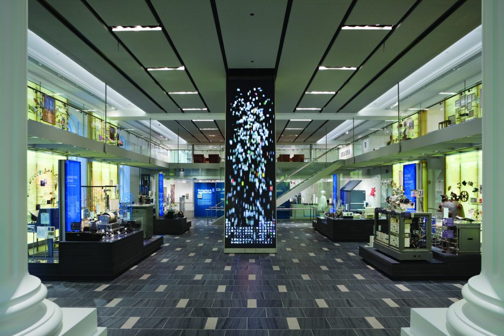 Colour photograph of a view of the Chemical Heritage Foundation including a video column showing the periodic table