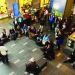 Colour photograph of an actor giving a performance for visitors in the Chemical Heritage Foundation