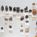 Colour photograph of a number of mineral samples of rock types that are used in modern consumer technologies