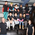 Colour photograph of the team of young participants in museum shirts