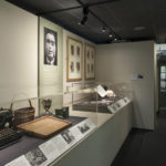 Colour photograph of a gallery view of Wounded exhibition object displays