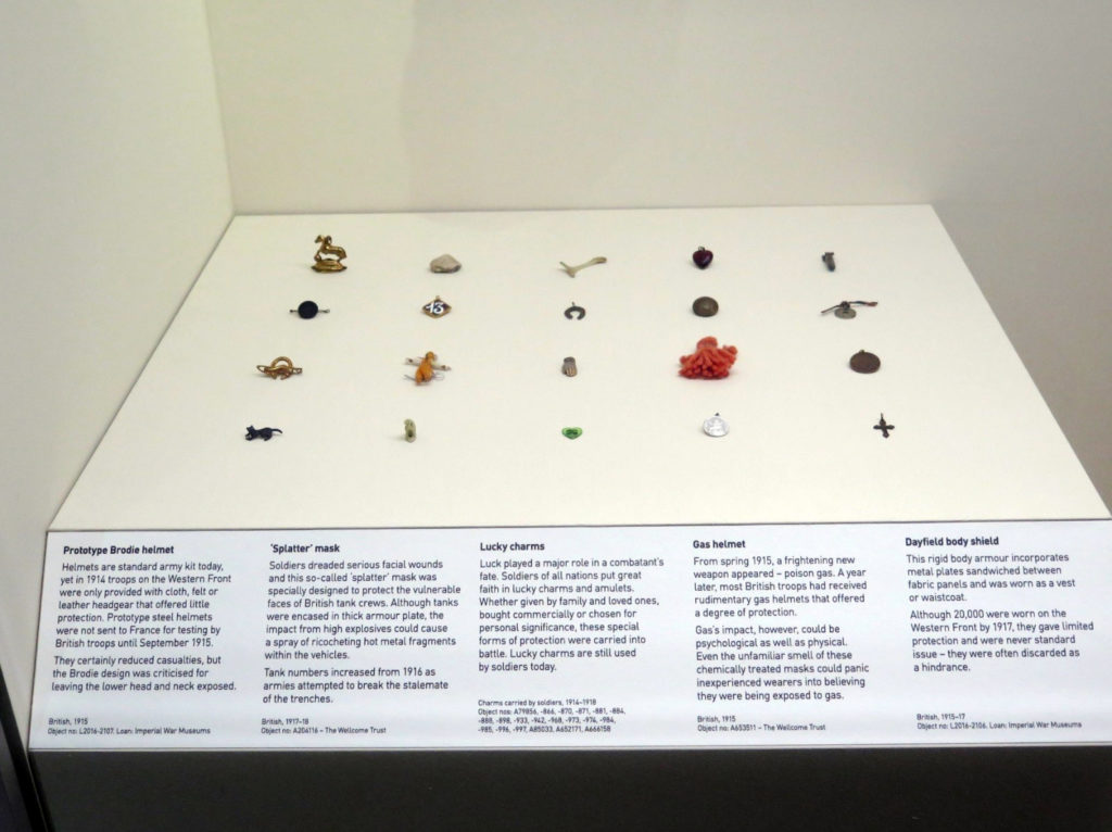 Colour photograph of a case displaying soldiers lucky charms