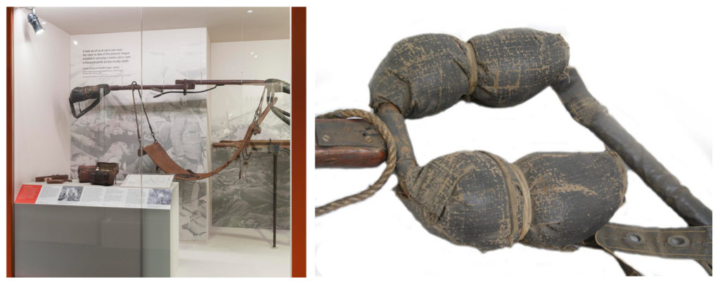 Colour photograph of a field stretcher on display in the gallery