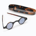 Colour photograph of tortoiseshell straight spectacle frames lined with velvet