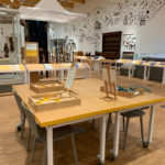 Colour photograph of an interactive display table in an exhibition gallery