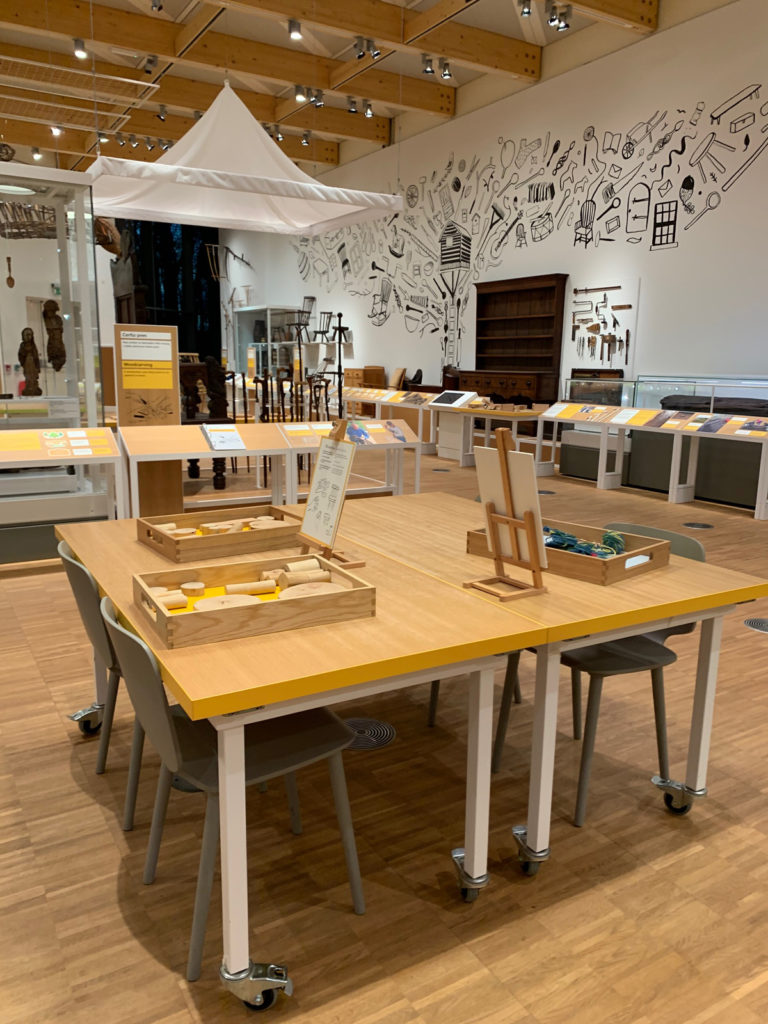 Colour photograph of an interactive display table in an exhibition gallery