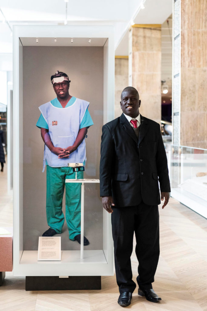 Colour photograph of Samson Lokele with Sîan Daveys on gallery portrait