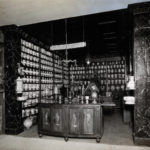 Black and white photograph of a reconstruction of a seventeenth century Italian pharmacy