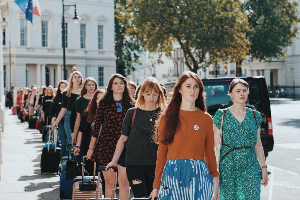 A group of women form a line in silent protest