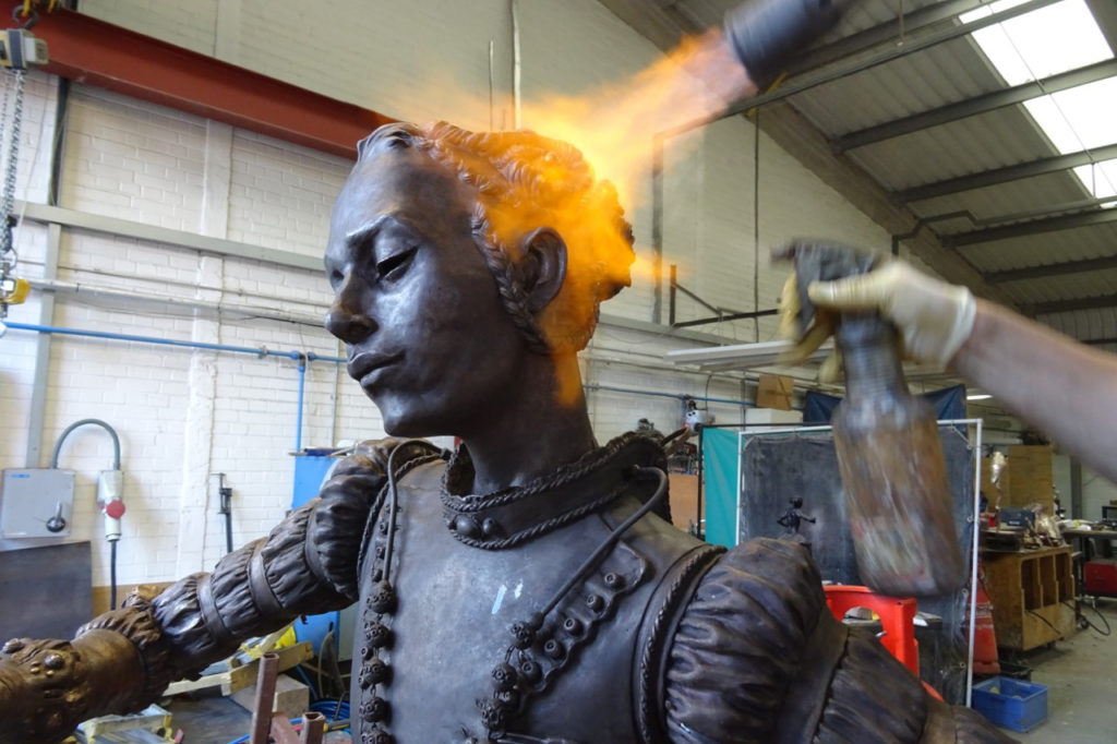 Colour photograph of the Santa Medicina sculpture being blow torched