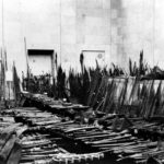 Black and white photograph of a cache of spears and swords
