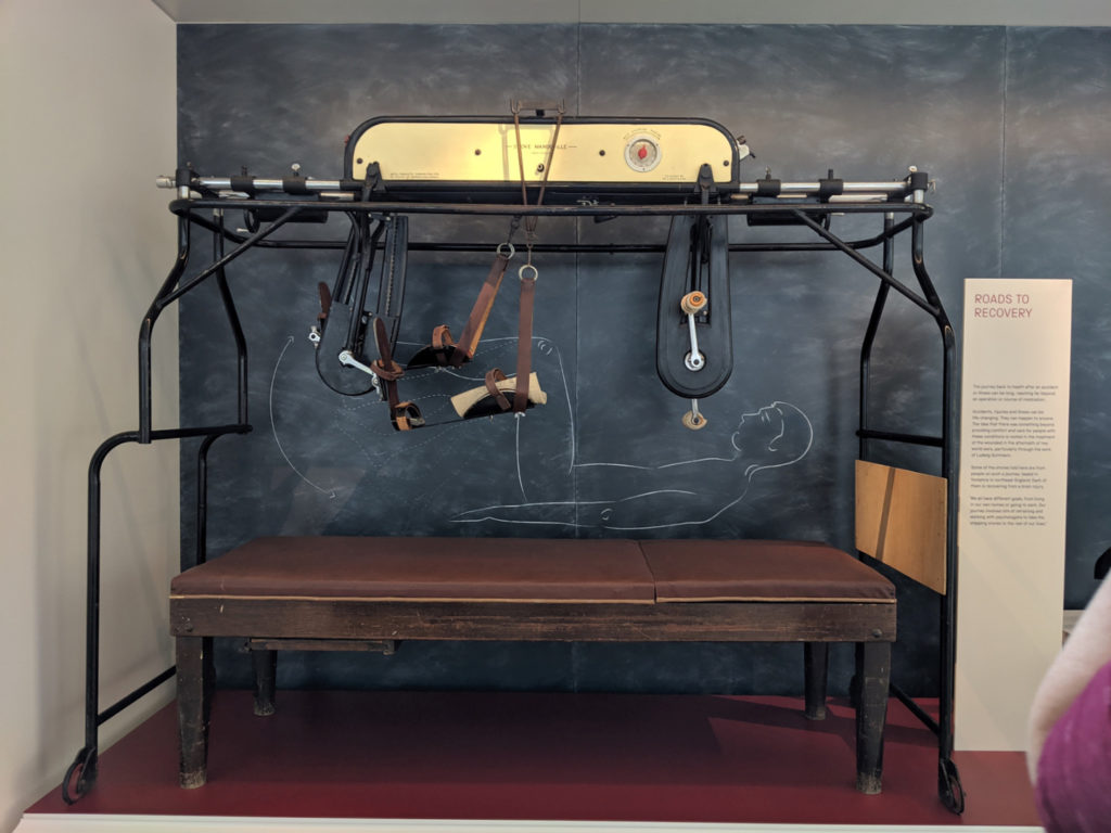 Colour photograph of a bed cycle object on display