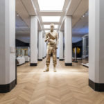 Colour photograph of the Self Conscious Gene sculpture situated on gallery