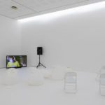 Colour photograph of a video showing in an exhibition