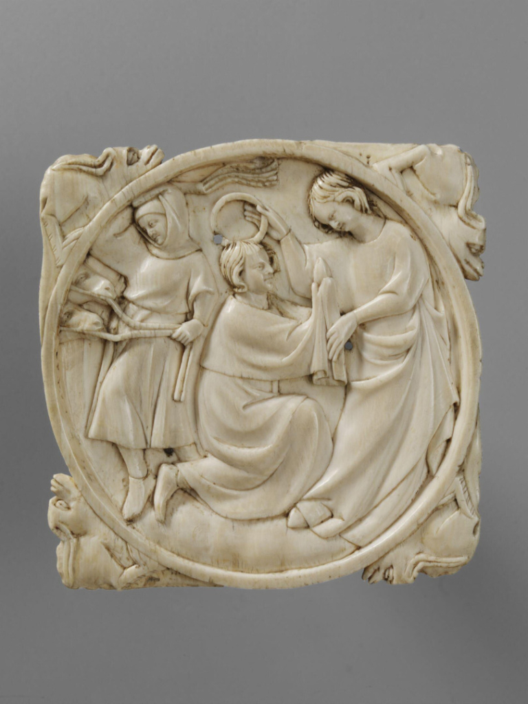 An ivory mirror case engraving of a lady crowning her lover who offers his heart