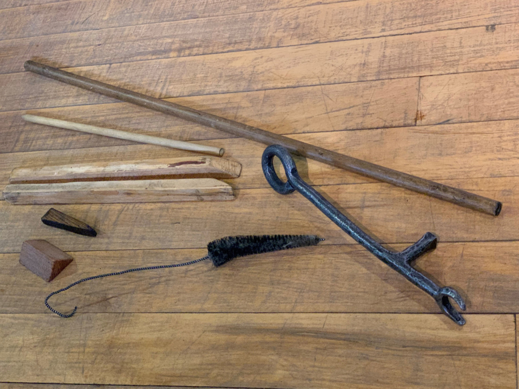 Colour photograph of stick objects to be used on the museum machinery demonstrations
