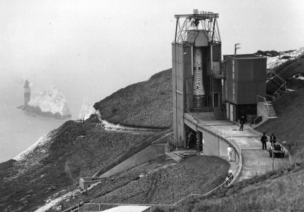 Black and white photograph of the Black Arrow R0 rocket readied for launch