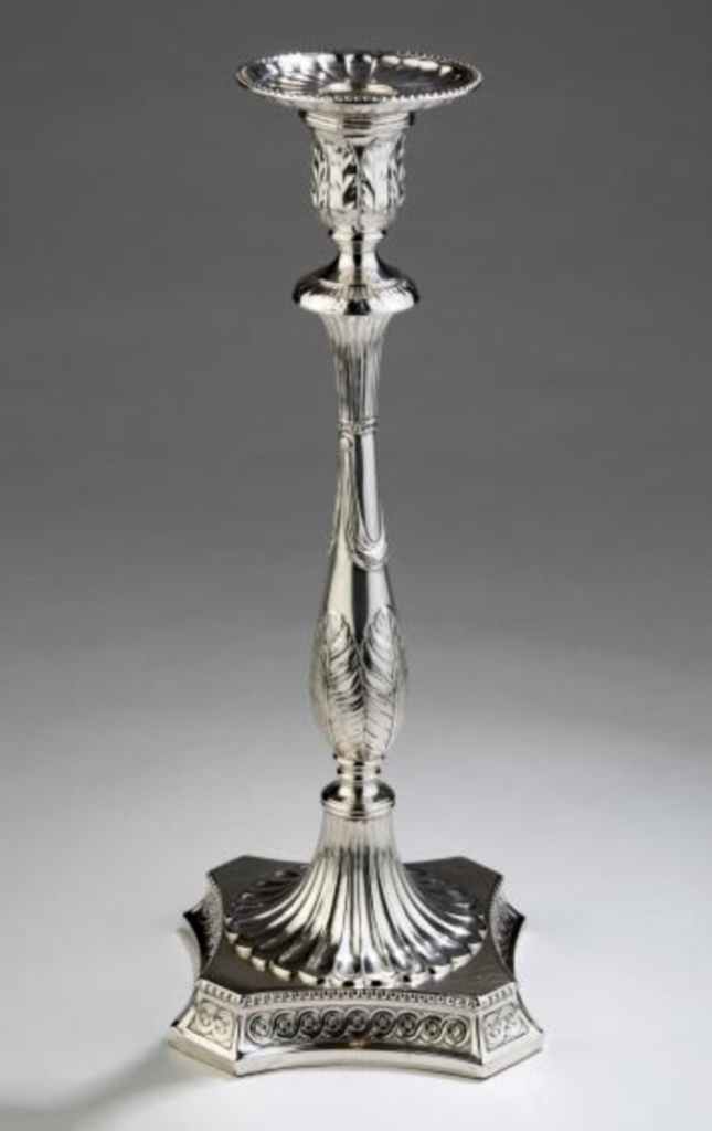 One of a pair of die struck Sheffield plate candlesticks from 1775