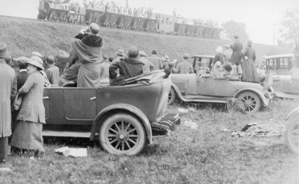 Black and white photograph of spectators at a railway centenary procession in 1925