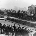 Black and white photograph of Locomotion Number One hauling a replica train in 1925