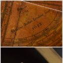 Two colour photographs of historical scientific measuring instruments