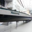 Colour photograph of the Turbinia sea vessel on display in a museum