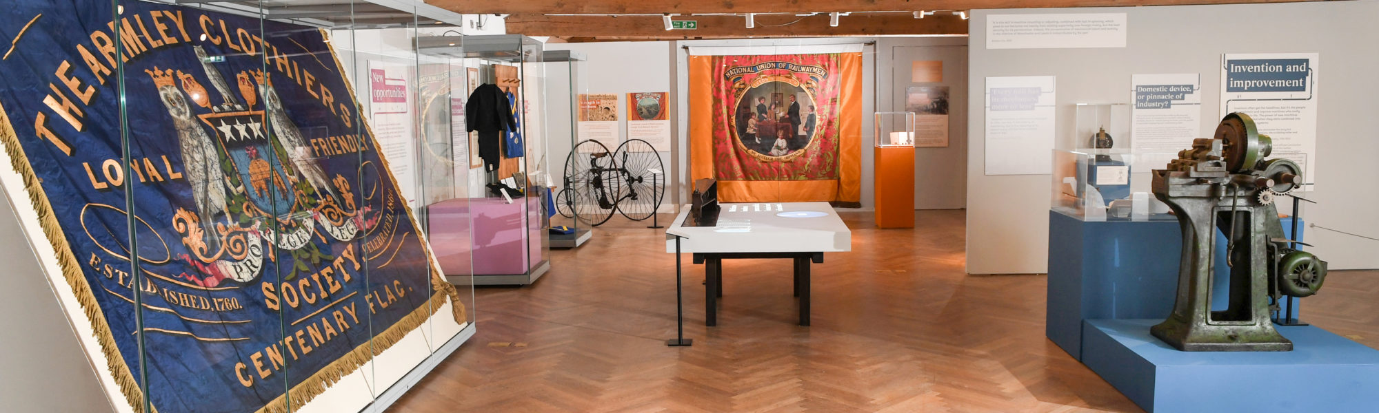 Photograph of a museum exhibit showing the Armley banner