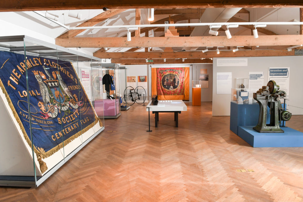 Photograph of a museum exhibit showing the Armley banner