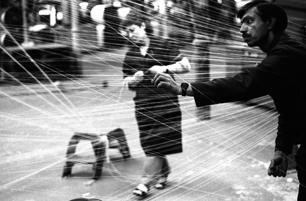 Black and white photograph of staff in the warping department of a mill