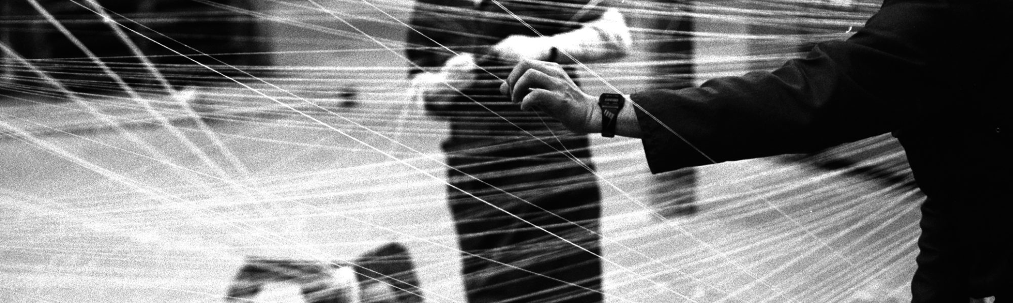 Black and white photograph of staff in the warping department of a mill