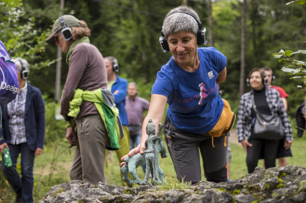 Colour photographs of participants of a sound walk in woodland