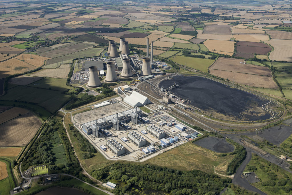 Colour aerial photograph of a Combined Cycle Gas Turbine station and a coal fired power station in rural Nottinghamshire