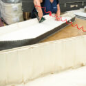 Photograph of a woman making a biodegradable coffins