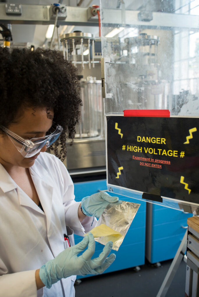 Photograph of a researcher in electro spinning at the University of Leeds