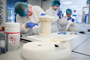 Photograph of reels of silk being used in a Research and Development lab