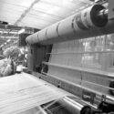 Photograph of workers setting up a loom in the weaving department at Listers Manningham Mill in 1989