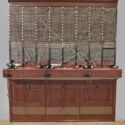 Colour photograph of a three person telephone switchboard