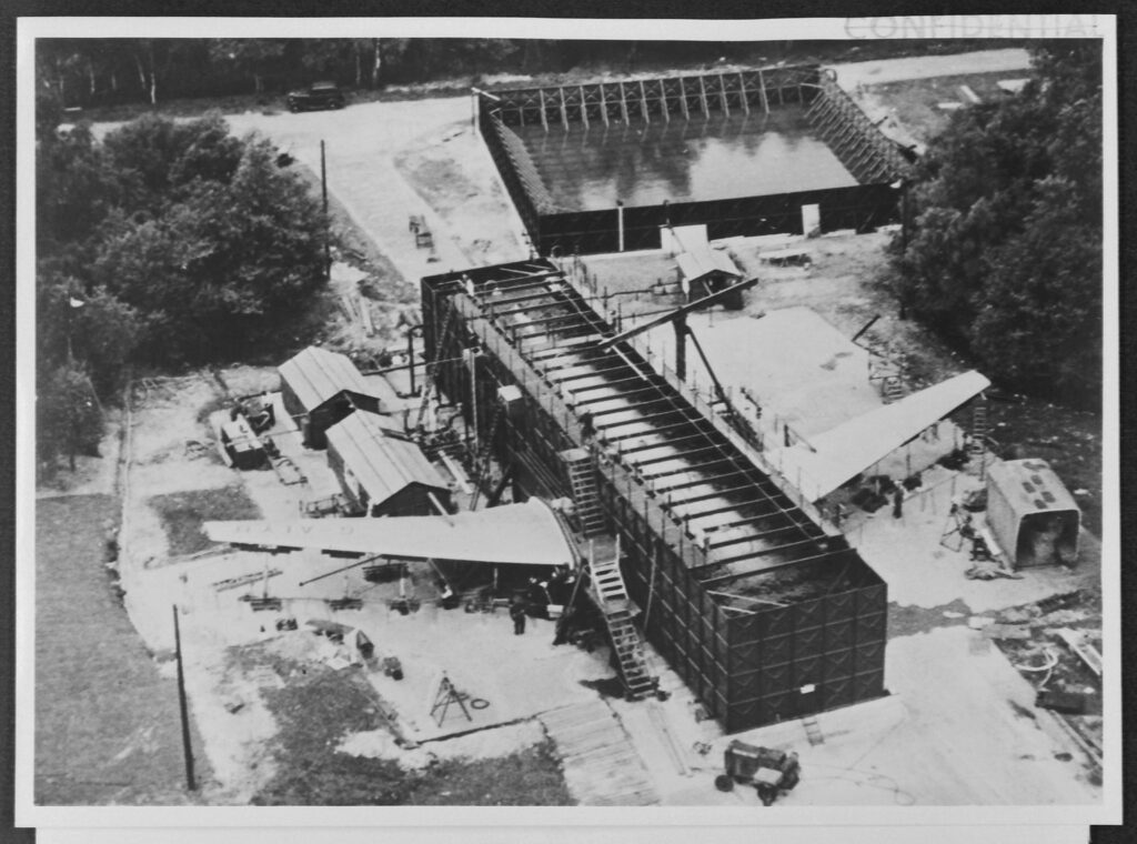 Black and white aerial photograph of a Comet aircraft undergoing tests circa 1954
