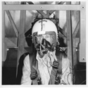 Black and white photograph of Phil Catling wearing equipment to test eye tracking ability under vibration in 1975
