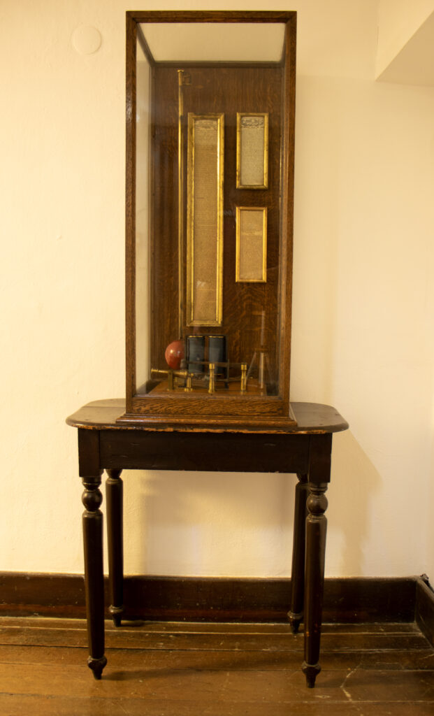 Photograph of an electrically controlled model time ball and time gun on display