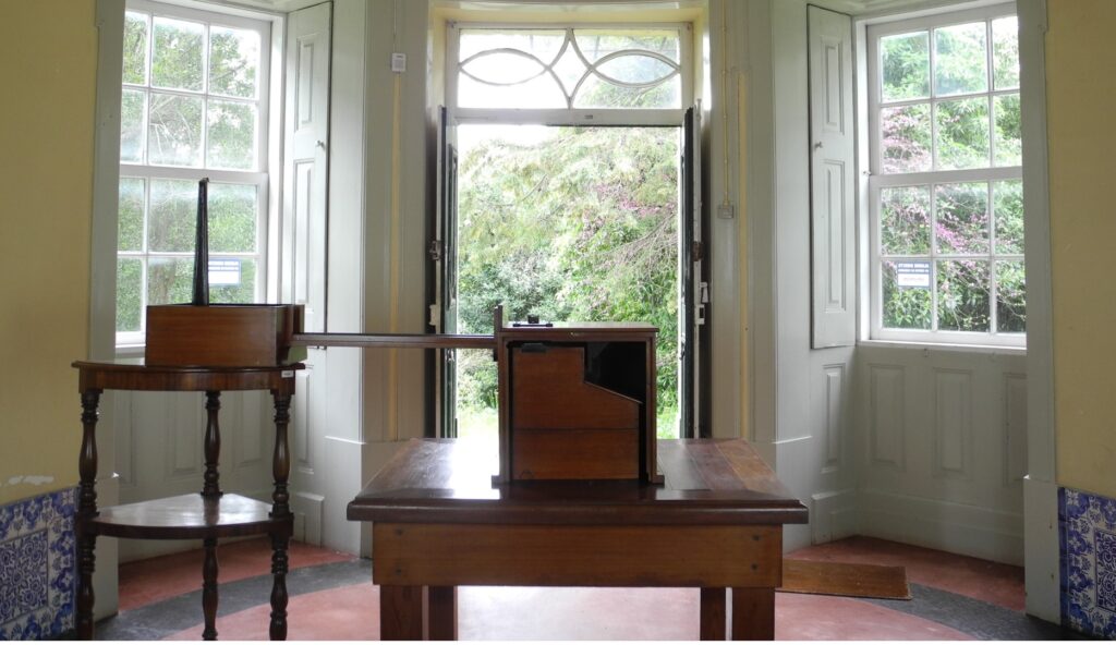 Photograph of the Milne seismograph set up in the main hall