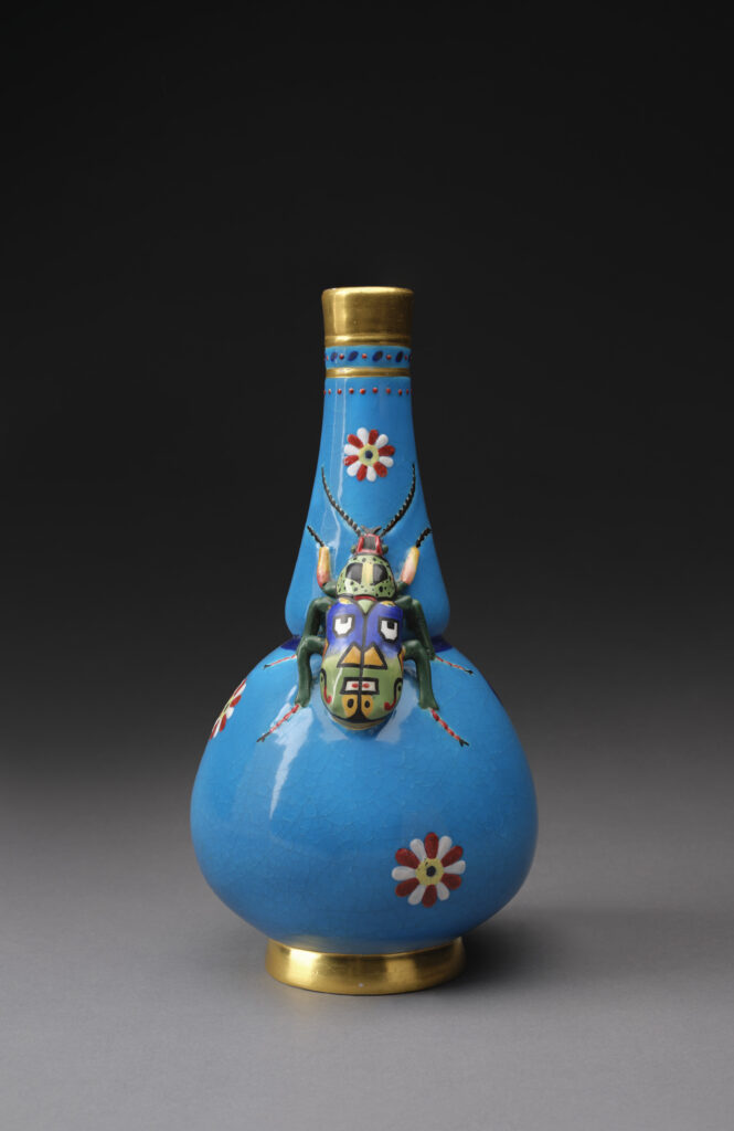 Colour photograph of a porcelain vase decorated with a beetle from 1872