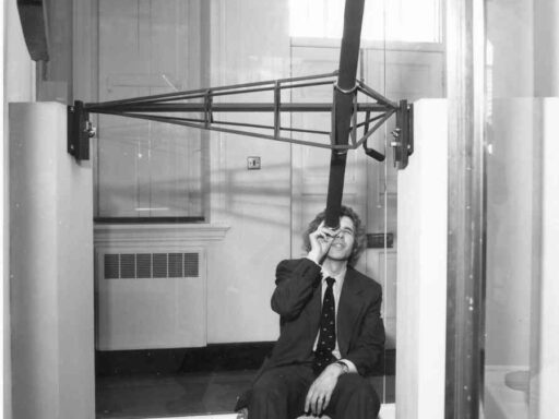 Black and white photograph of Jim Bennett with Halleys Transit Instrument circa 1977