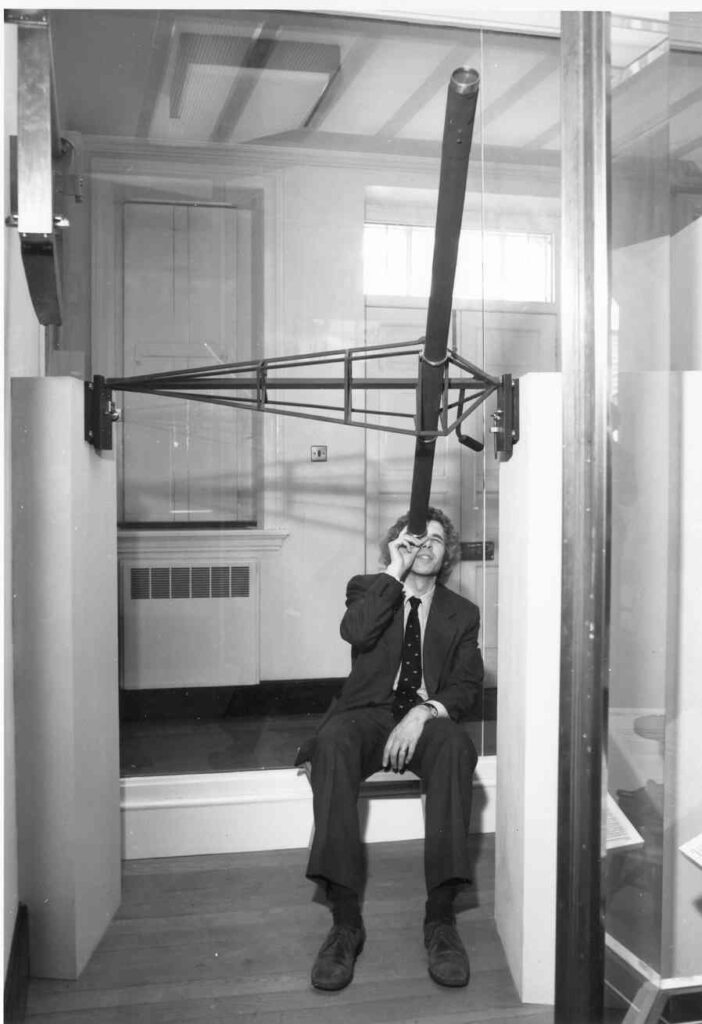 Black and white photograph of Jim Bennett with Halleys Transit Instrument circa 1977
