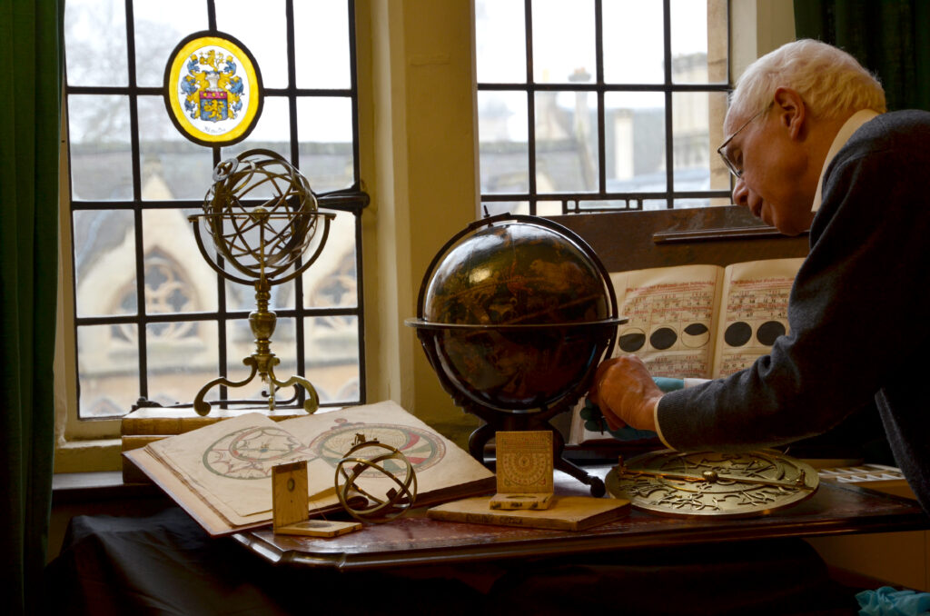 Colour photograph of Jim Bennett with astronomical objects