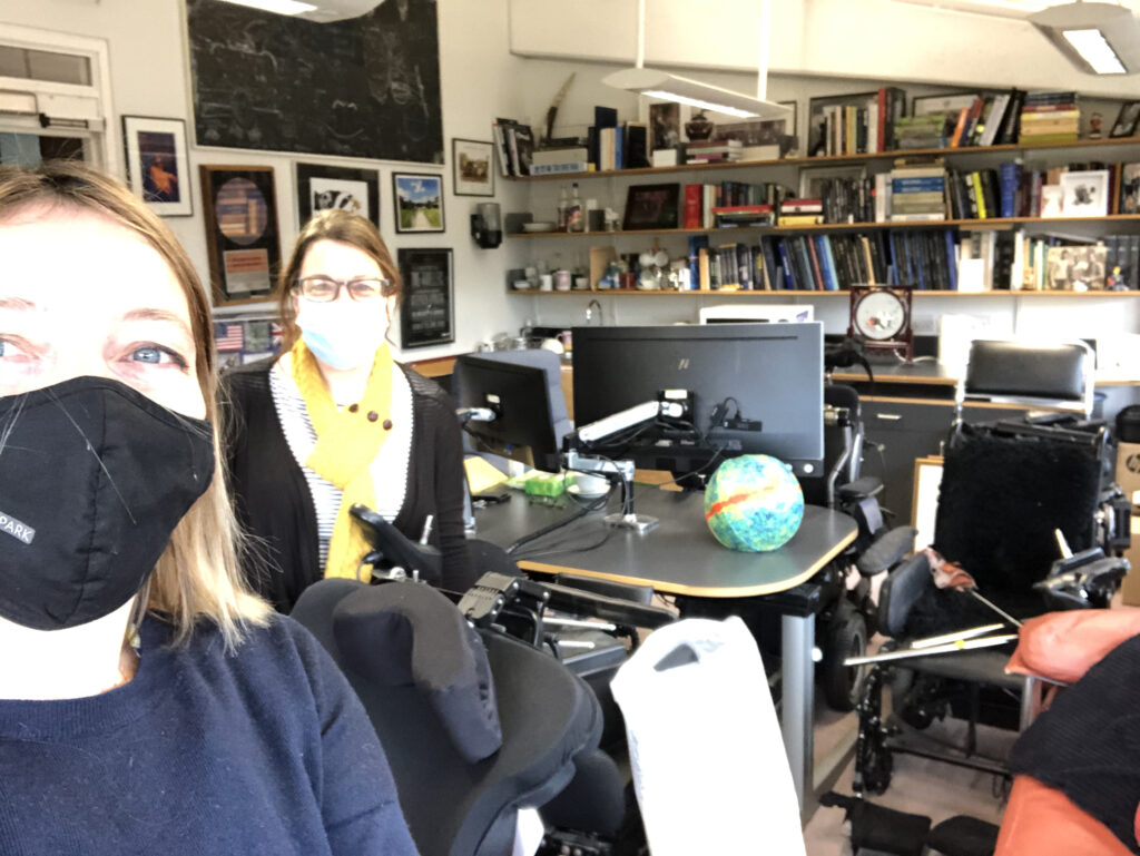 Colour photographs of the authors visiting Stephen Hawkings office